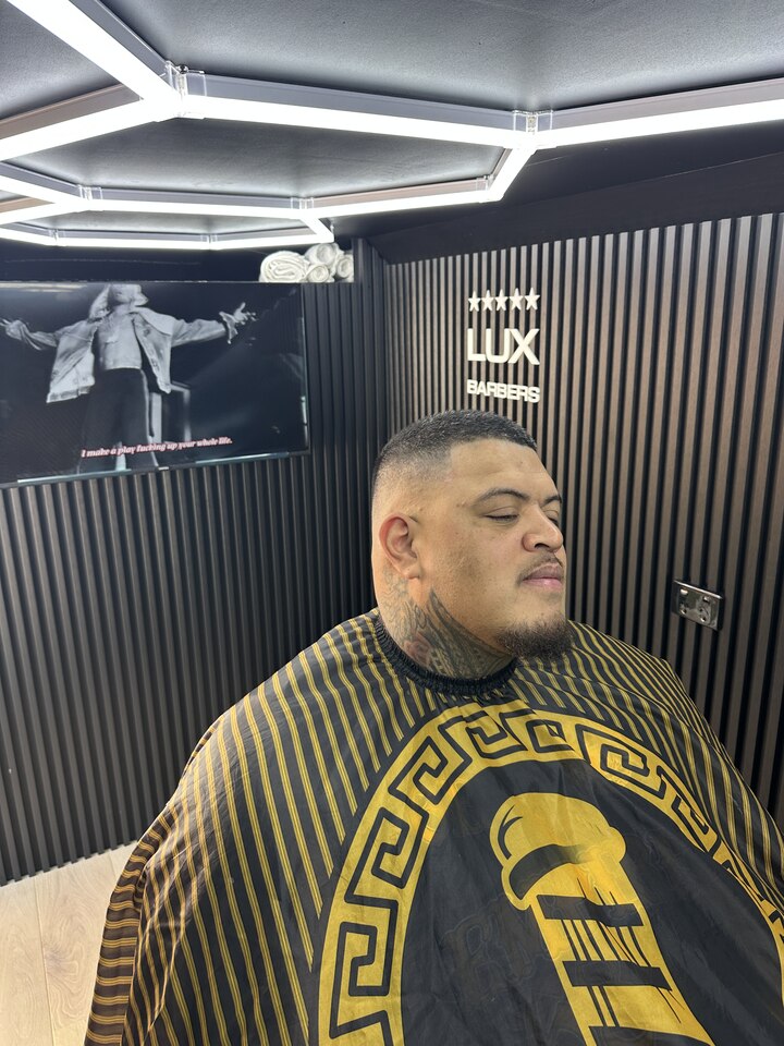A Lux Barbers client fresh from the chair in the mobile studio