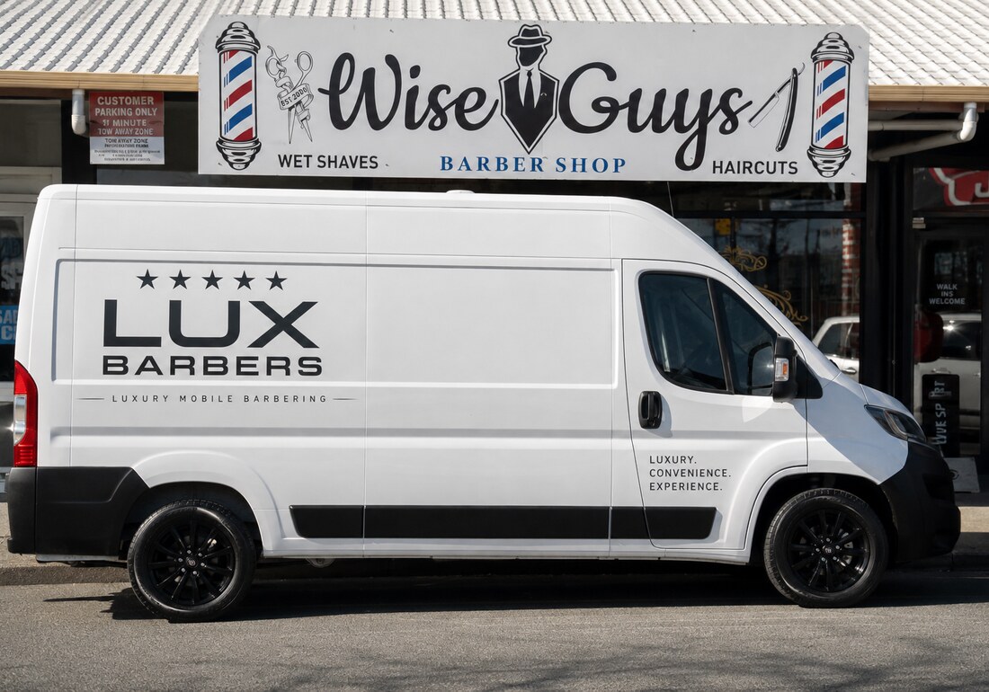 The Lux Barbers van parked outside the Wise Guys barbershop