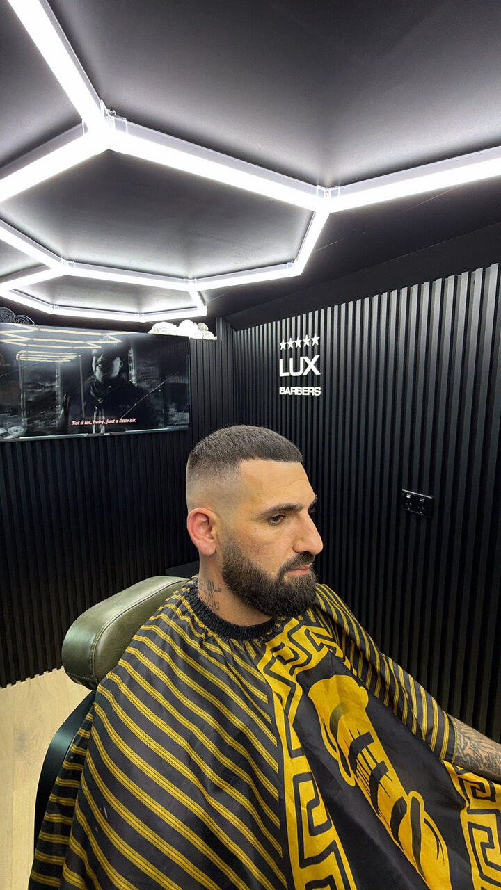 Sharp fade and beard trim finished in the Lux Barbers chair