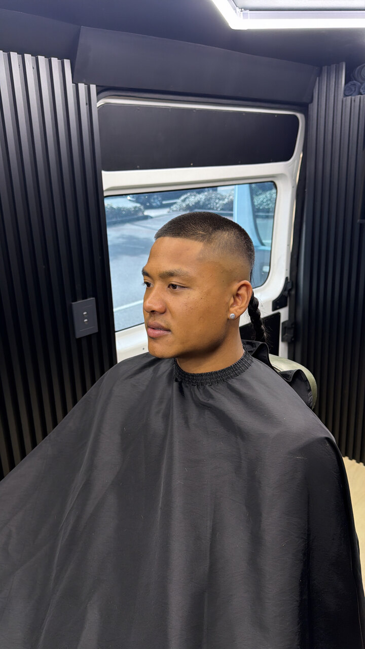 A clean skin fade in the Lux Barbers mobile studio